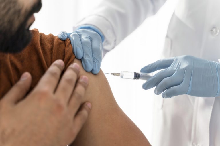 man-being-vaccinating-by-doctor-close-up